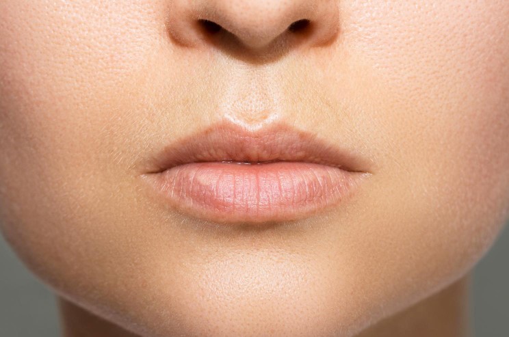 closeup-female-lips-after-permanent-makeup-lip-blushing-procedure.jpg