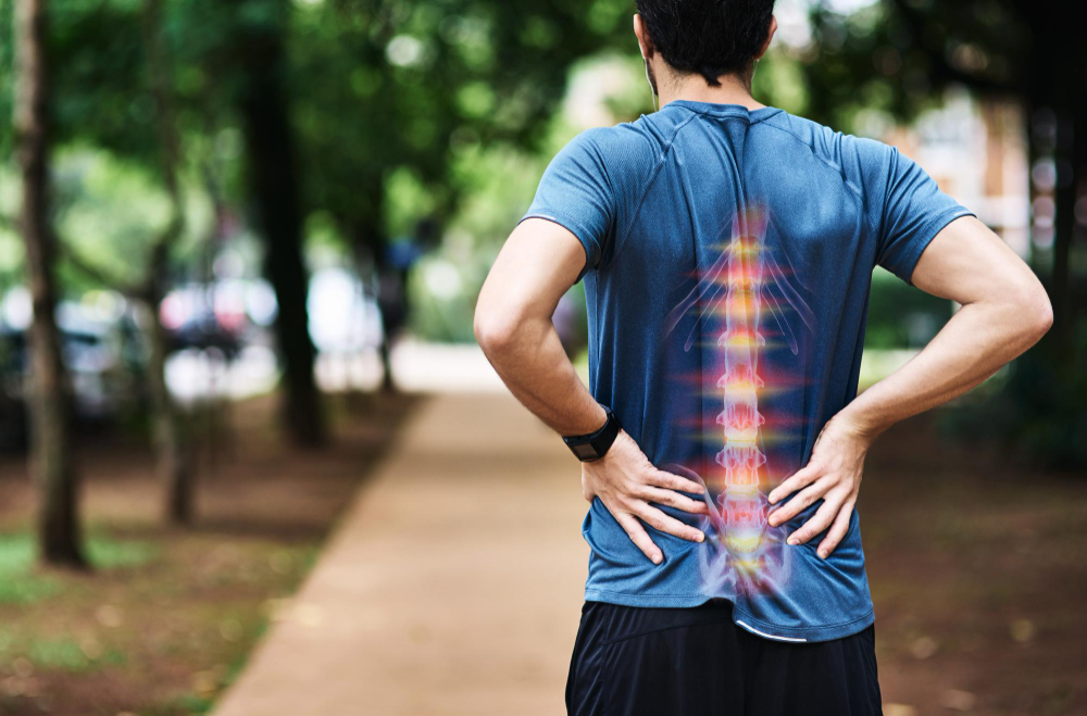 hes-overdone-it-this-time-with-his-training-rear-view-shot-sporty-young-man-holding-his-back-pain-while-exercising-outdoors.jpg