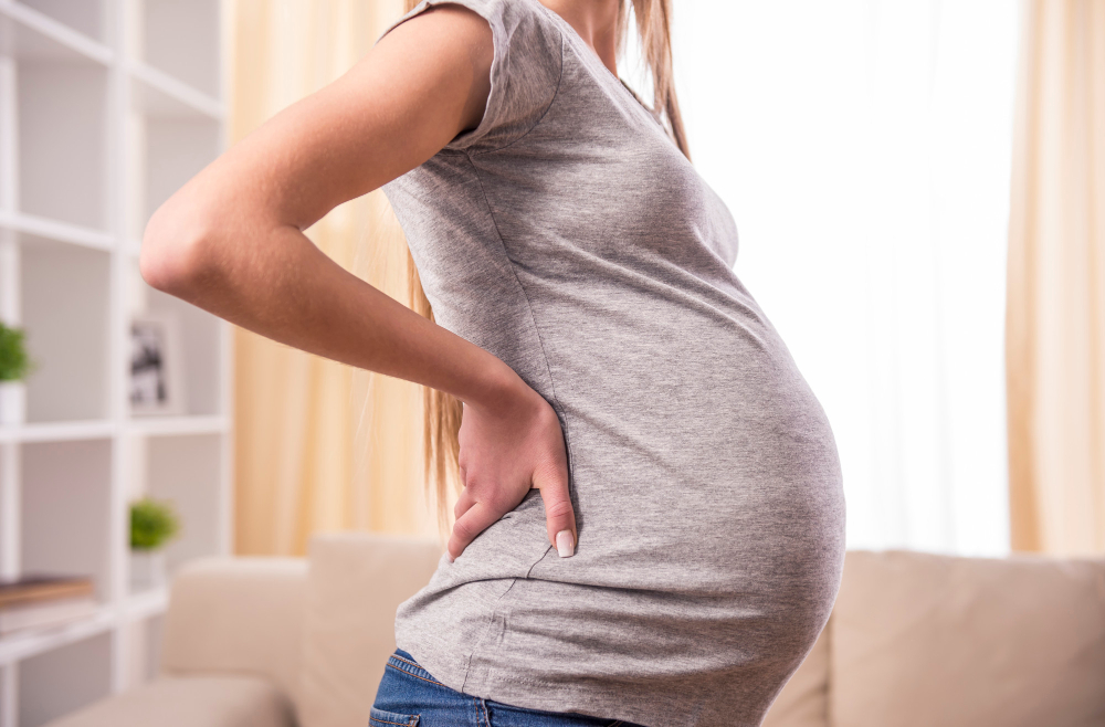 pregnant-woman-with-hands-tummy-home.jpg