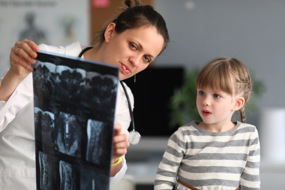 woman-doctor-shows-child-patient-xray-clinic.jpg