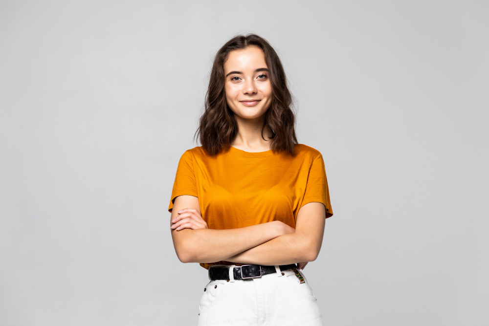 portrait-beautiful-young-woman-standing-grey-wall.jpg