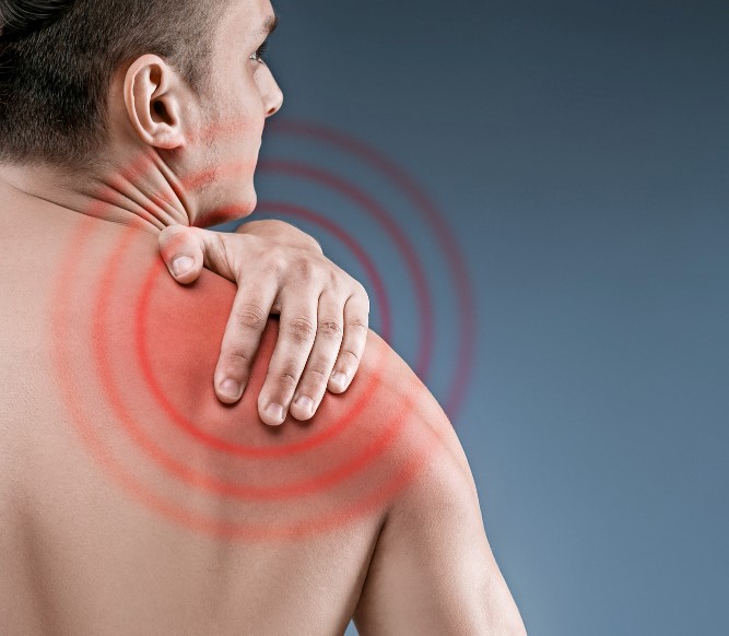 man-with-pain-shoulder-pain-human-body-black-white-photo-with-red-dot.jpg